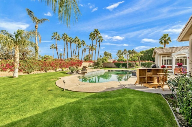 view of swimming pool with a pergola, a yard, a patio area, and exterior bar