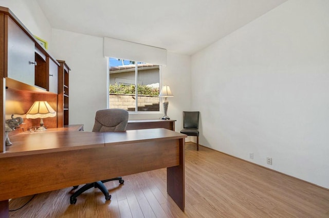 office with light wood-type flooring