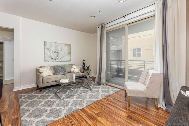 sitting room with hardwood / wood-style flooring