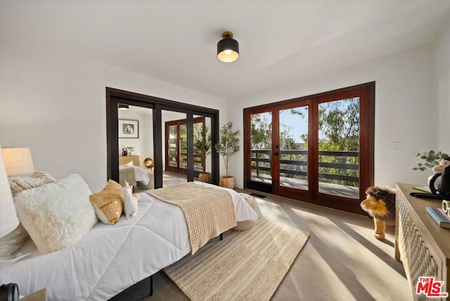 bedroom featuring access to exterior and french doors