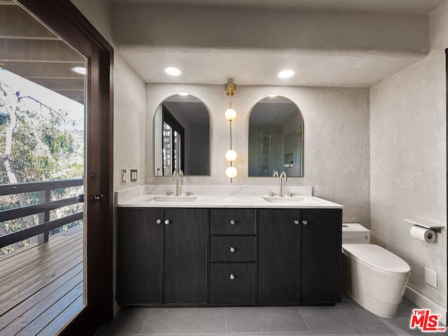 bathroom with vanity and tile patterned flooring