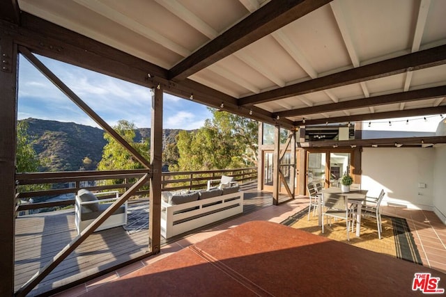 view of patio / terrace with a mountain view and outdoor lounge area