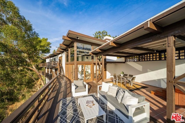 wooden deck with an outdoor hangout area