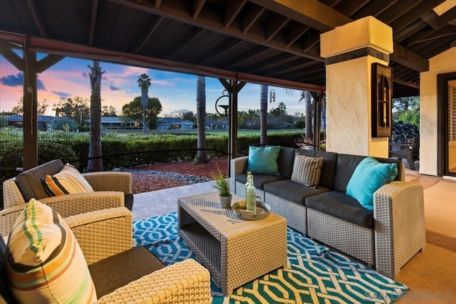 patio terrace at dusk with outdoor lounge area