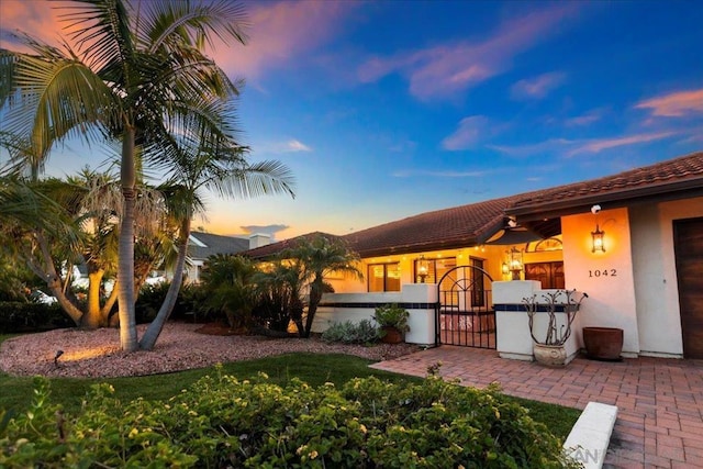 exterior space with ceiling fan