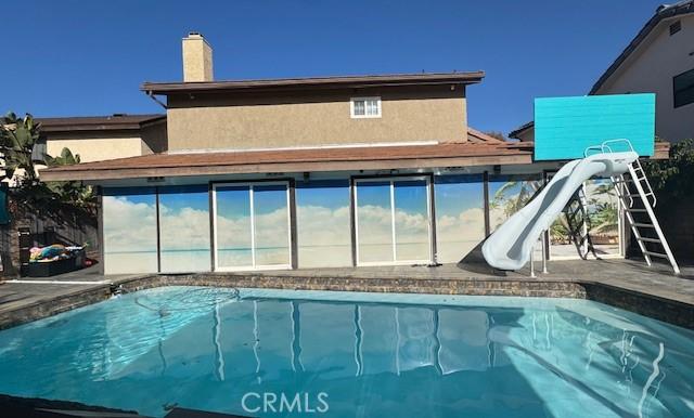 pool with a water slide