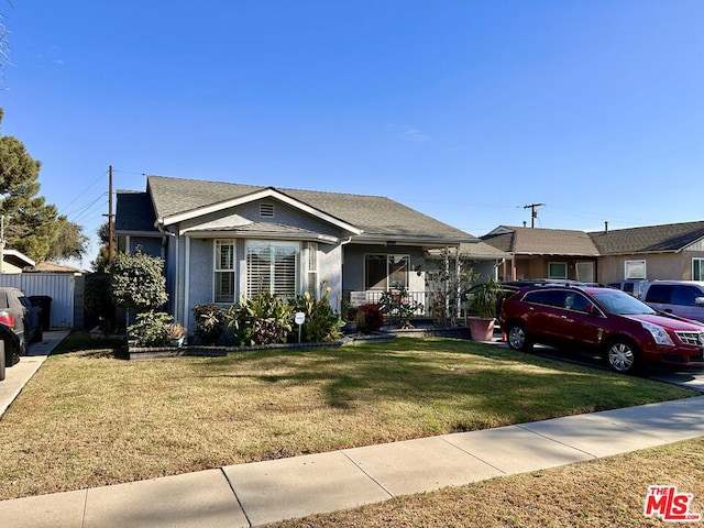 view of front of house with a front lawn and a porch