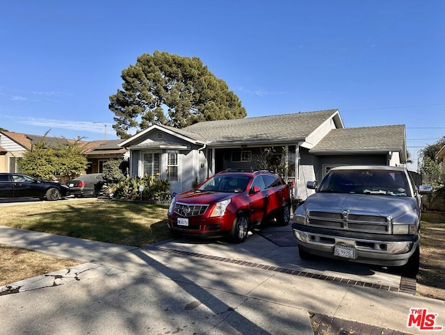 single story home with a front lawn and a garage