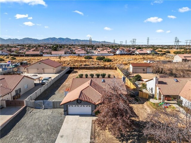 birds eye view of property featuring a mountain view