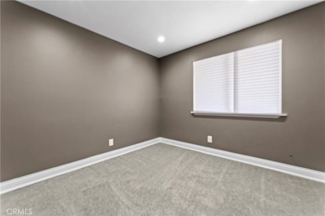 spare room with light carpet