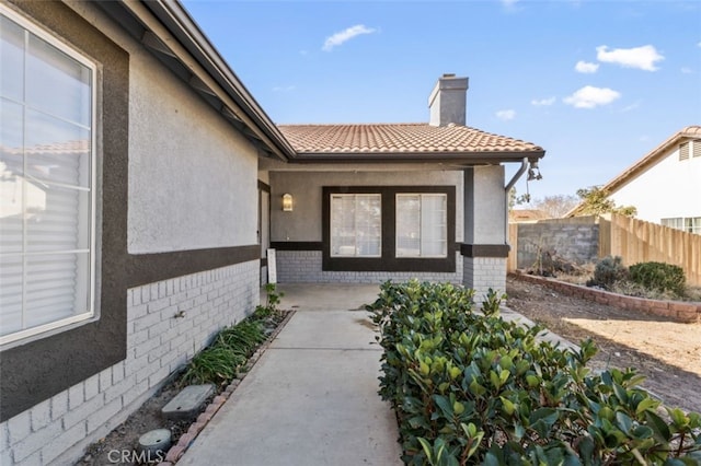 entrance to property featuring a patio area