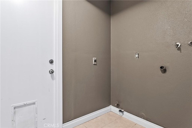 laundry room with light tile patterned floors, gas dryer hookup, and electric dryer hookup