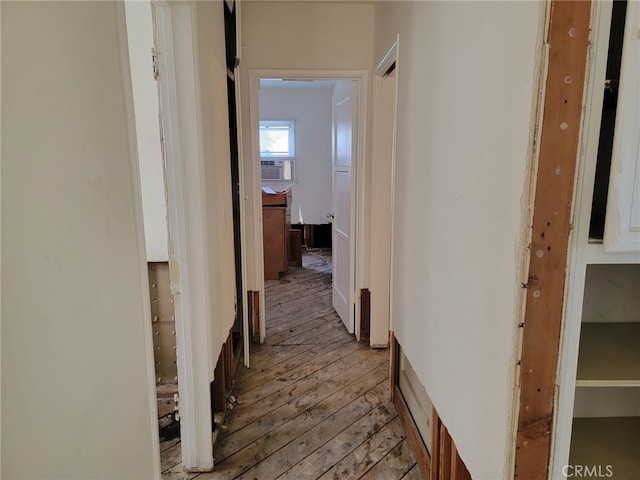 corridor with light wood-type flooring and cooling unit