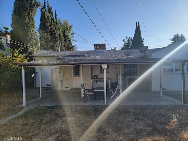 rear view of house featuring a patio