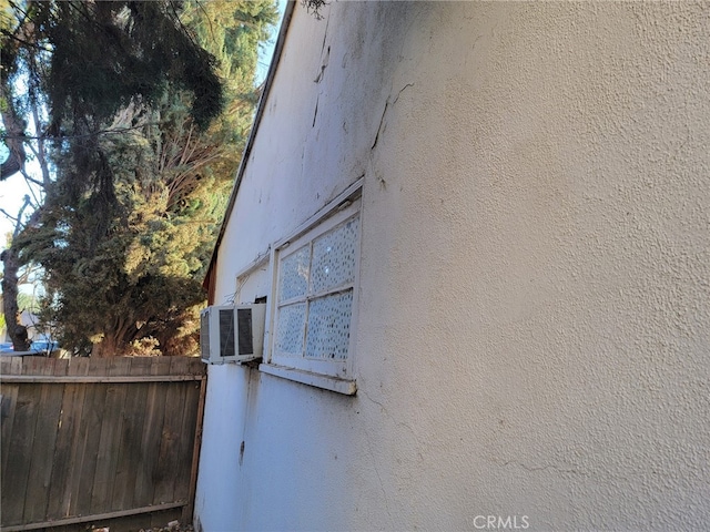 view of side of home with cooling unit