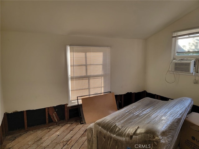 dining room with cooling unit and vaulted ceiling