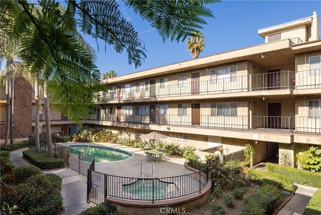 view of swimming pool with a patio