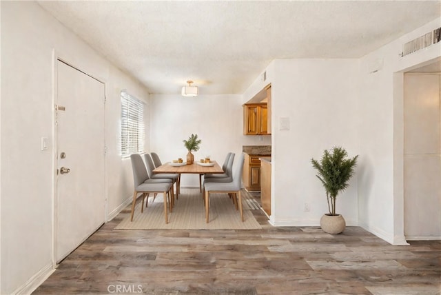 dining room with hardwood / wood-style floors