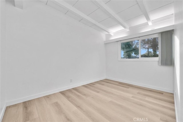 spare room with wooden ceiling, light hardwood / wood-style flooring, and beam ceiling