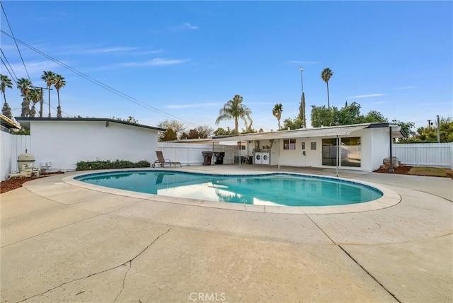 view of swimming pool with a patio area