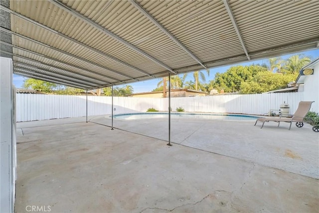 view of patio featuring an empty pool