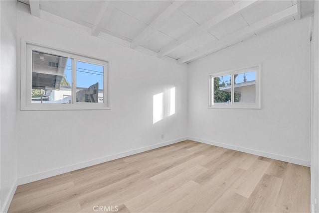 unfurnished room with light wood-type flooring, wood ceiling, and vaulted ceiling with beams