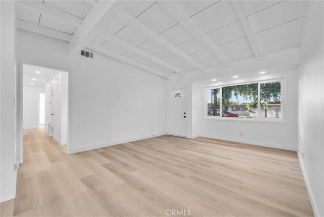 empty room with wooden ceiling, light hardwood / wood-style flooring, and vaulted ceiling with beams