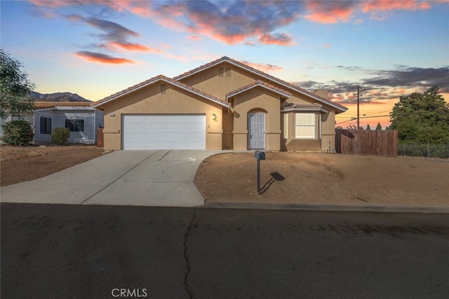 view of front of property with a garage