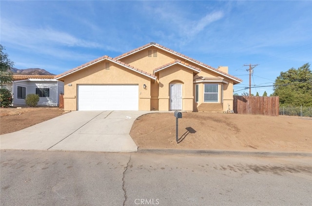 view of front of home with a garage