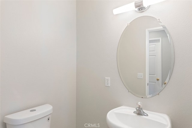 bathroom with sink and toilet