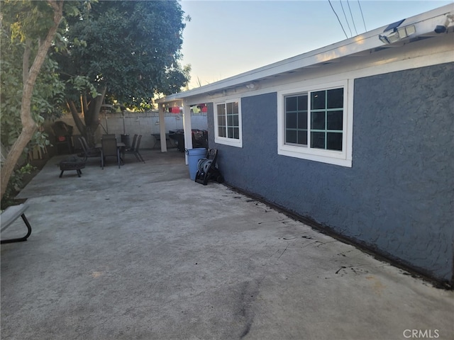 2214 Mark St, Santa Ana, CA 92703 - patio terrace at dusk featuring fence