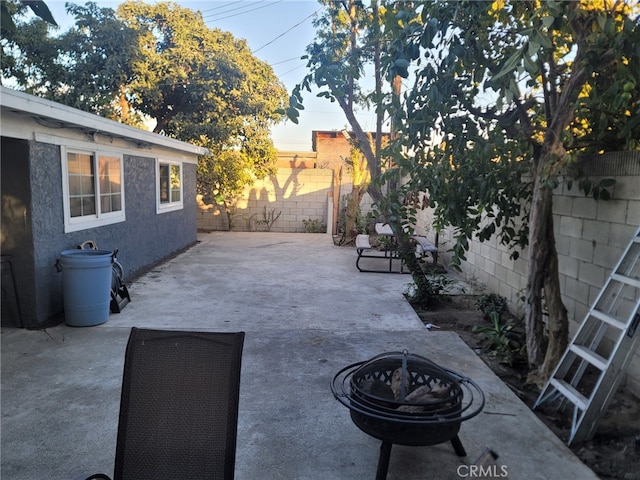 2214 Mark St, Santa Ana, CA 92703 - view of patio featuring a fenced backyard and a fire pit