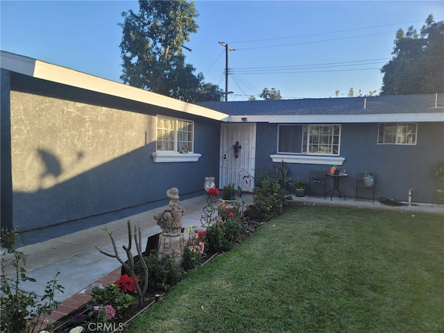 2214 Mark St, Santa Ana, CA 92703 - view of front of house with a front lawn and stucco siding