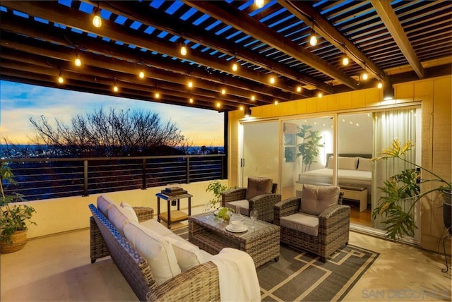 patio terrace at dusk with outdoor lounge area and a pergola