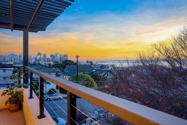 view of balcony at dusk