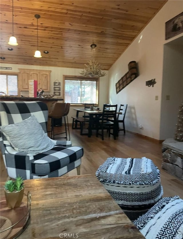 living room featuring vaulted ceiling, hardwood / wood-style flooring, and wooden ceiling