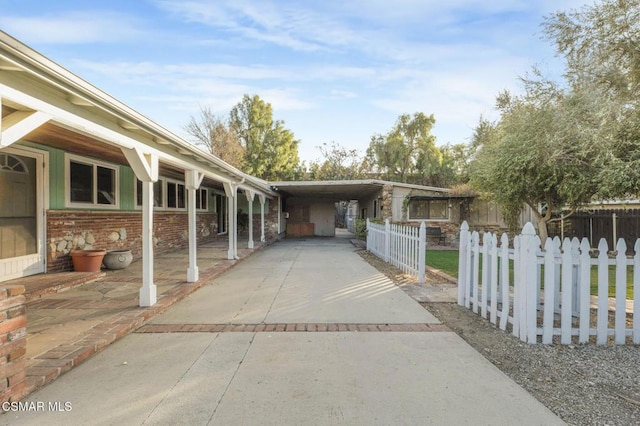 view of side of home featuring a carport