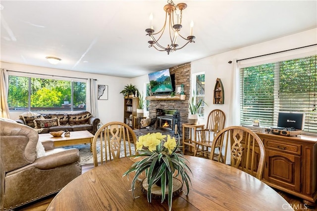 dining room with hardwood / wood-style flooring and an inviting chandelier