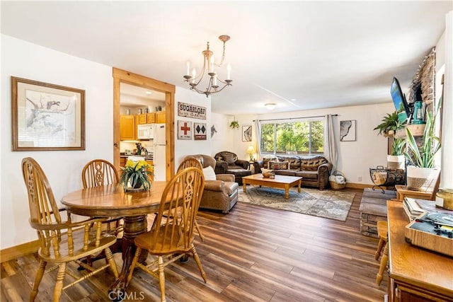 dining area featuring a chandelier and hardwood / wood-style flooring