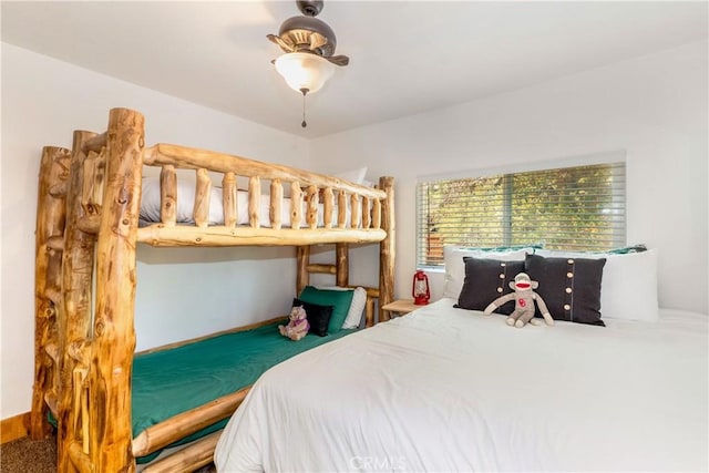 bedroom with ceiling fan and carpet