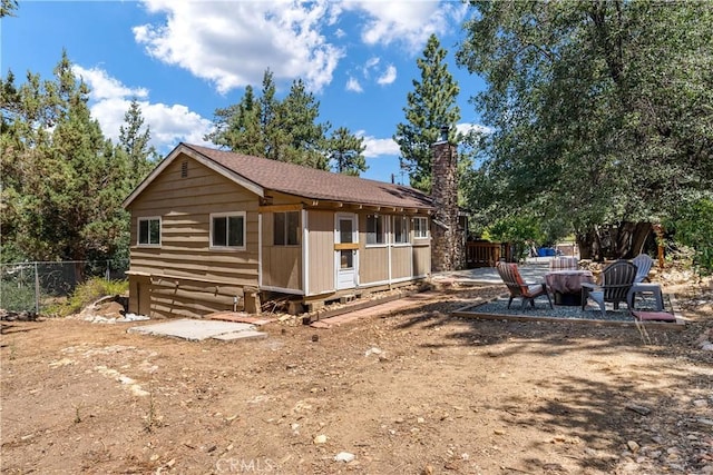 view of front of house with an outdoor fire pit