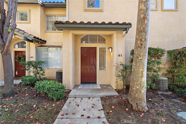 entrance to property featuring central AC unit