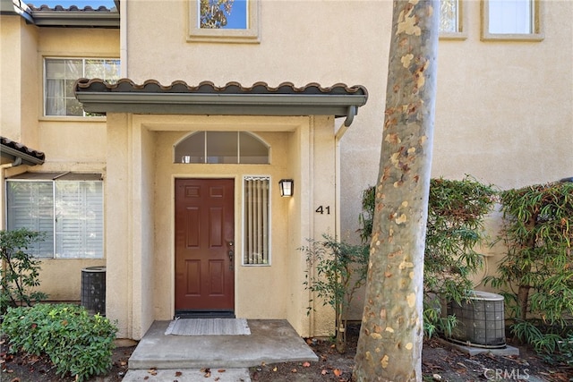 property entrance with central air condition unit