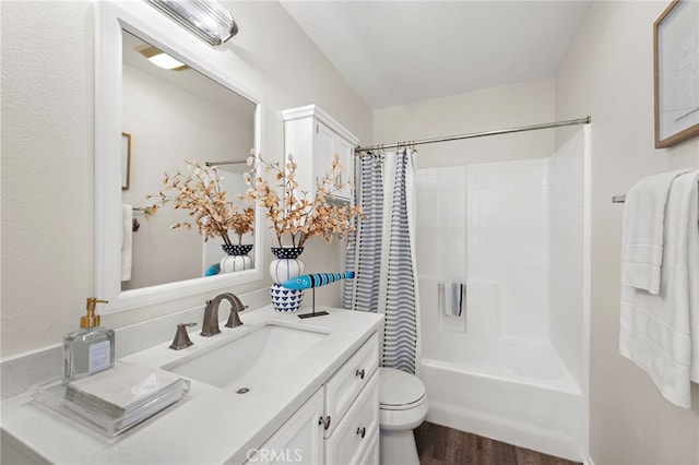 full bathroom featuring toilet, vanity, wood-type flooring, and shower / bath combination with curtain