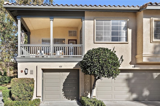 view of front of house with a balcony and a garage