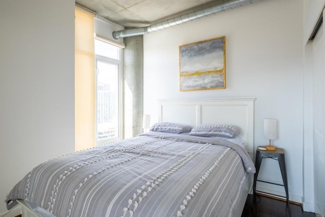 bedroom featuring dark wood-type flooring