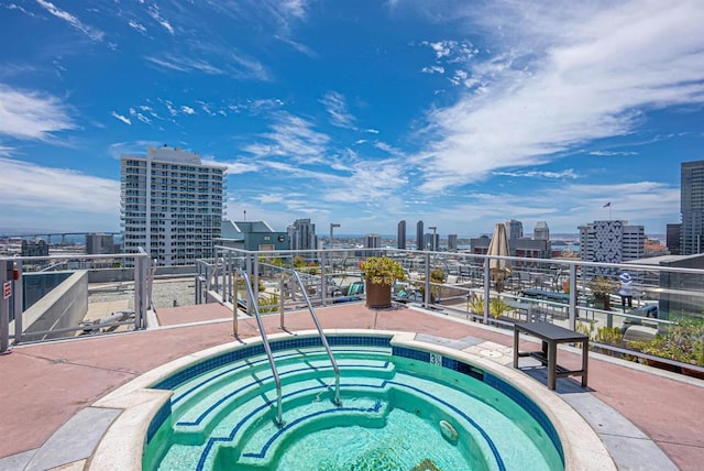 view of pool with a community hot tub