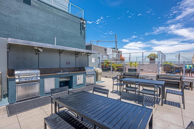 view of patio / terrace with sink, a grill, and area for grilling