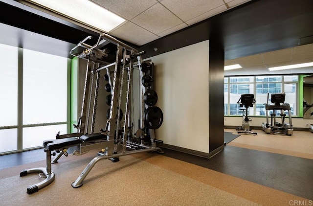 gym featuring a paneled ceiling