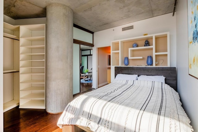 bedroom featuring dark wood-type flooring